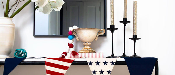 a mantle decorated for the fourth of july