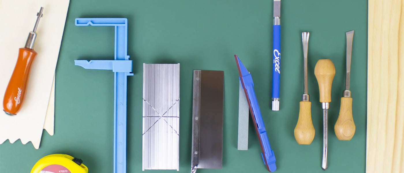 an array of woodworking tools laid out on a workspace