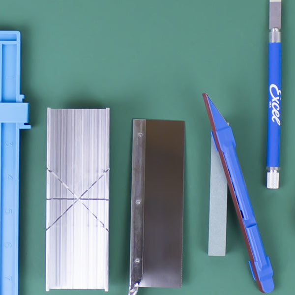 an array of woodworking tools laid out on a workspace