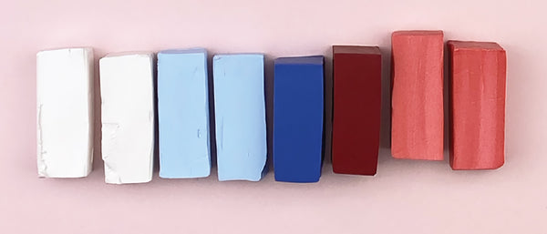 a line of different colored polymer clay blocks