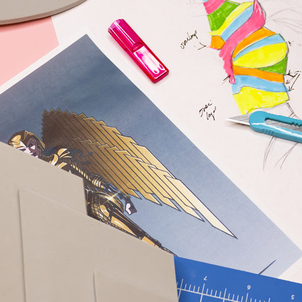 various cosplay diy materials next to a sketch and outline of a costume